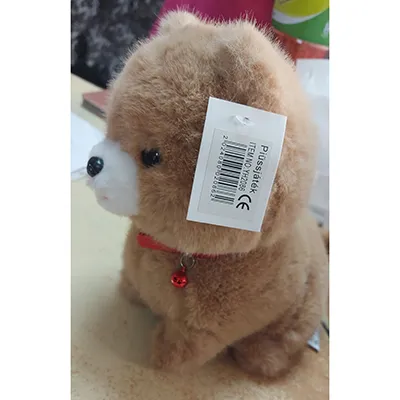 Brown soft toy in the shape of a dog with a rattle around the neck.