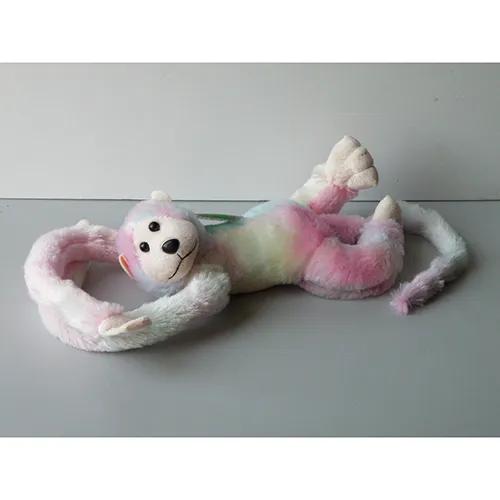Rainbow-coloured, sound-emitting plush monkey with velcro hands, plastic eyes, and nose.
