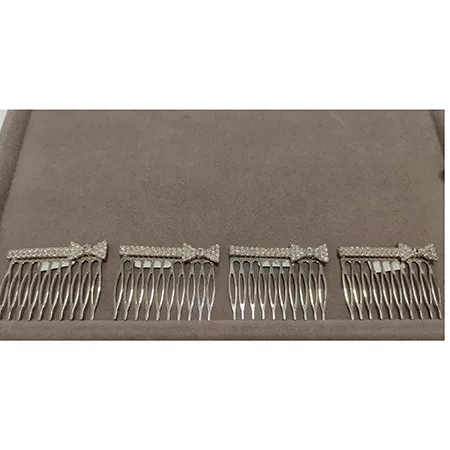 Metal decorative hair comb with a bow.