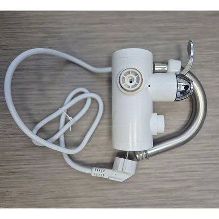 Instantaneous water heater - white body with a metal tap and a metal-coloured water drain handle.