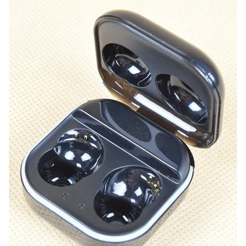 Black wireless earphones with charging cable.