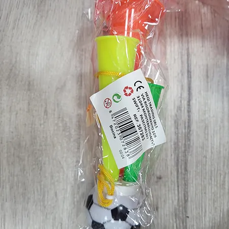 Toy horn with a football-shaped mouthpiece and three air exits in various colours.