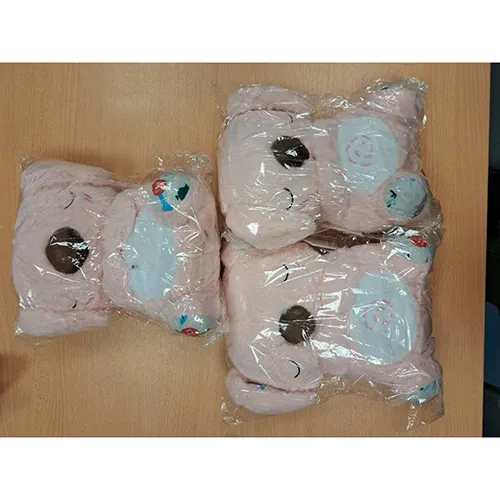 Soft toy in the shape of a pink koala, partially stuffed, containing an electrical component. The toy makes sounds and its tummy, which is illuminated by an internal LED, inflates and deflates as though breathing when the switches located under each of the feet are activated.
