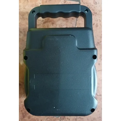 Wireless speaker with black plastic casing and built-in battery.