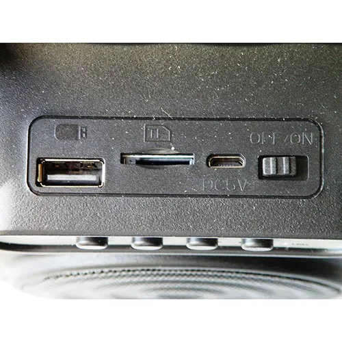 Wireless speaker with black plastic casing and built-in battery.