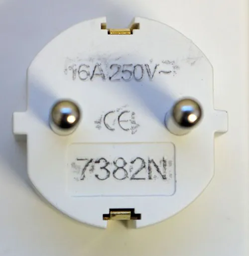 Double socket adaptor. Dimensions: height x width x depth = approximately 100 mm x 45 mm x 40 mm + base.