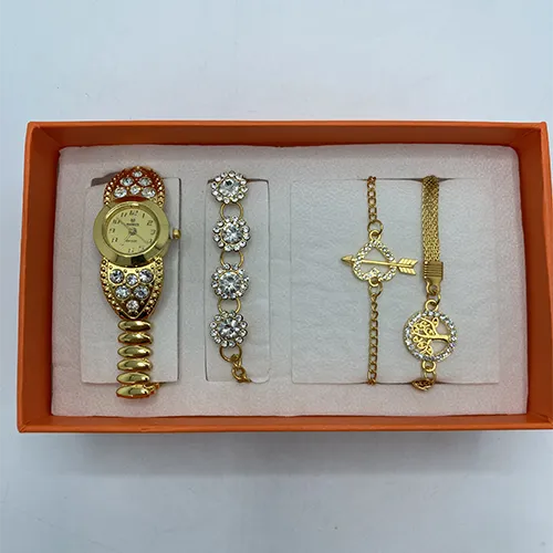 Jewelry set consisting of a wristwatch and bracelets.