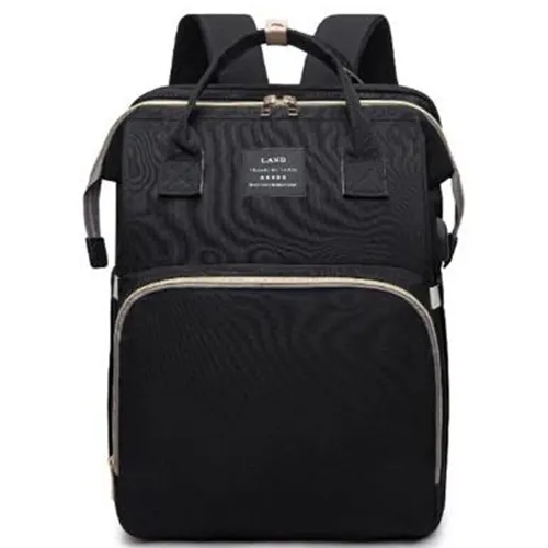 Backpack containing fold out crib with multiple compartments.