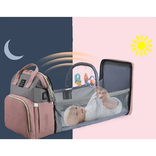 Backpack containing fold out crib with multiple compartments.