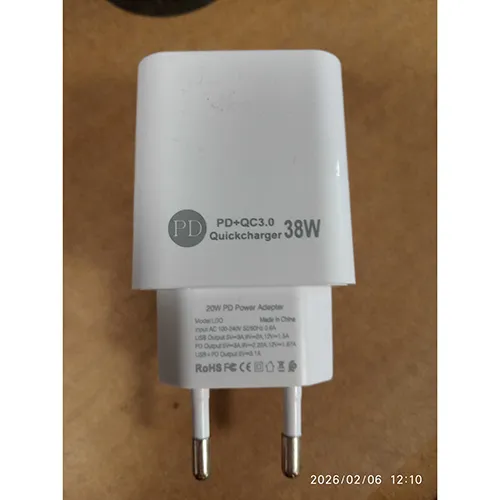 White mains fast charger adaptor with two USB ports (USB-A and USB-C). Marked with 