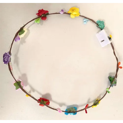 Light string garland with multicoloured flowers and battery operated lights.