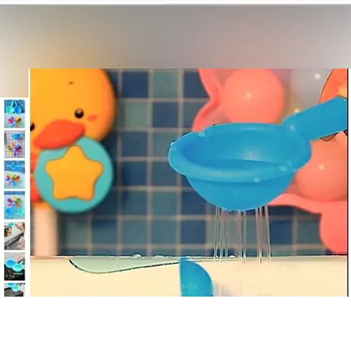 Plastic rainbow-coloured water wheel bath toy, with a blue colander and a green spoon. The bath toy can be mounted to the wall. The two suction cups are supplied unmounted and loose.