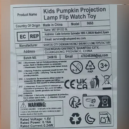 Orange plastic Halloween-themed watch toy in the shape of a pumpkin with button batteries.