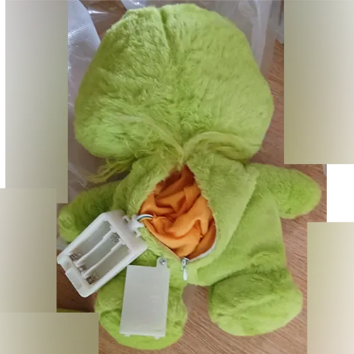 Green plush toy resembling the Grinch.