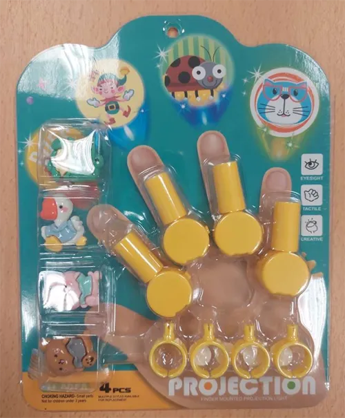 Toy set of 4 small light projectors made of yellow plastic and designed to be worn on the finger. The set also includes 4 removable decorative elements featuring children’s motifs.