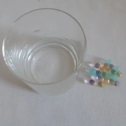 Multicoloured water beads, which grow when immersed in water, intended for use as ammunition in a toy rifle, 250 g.