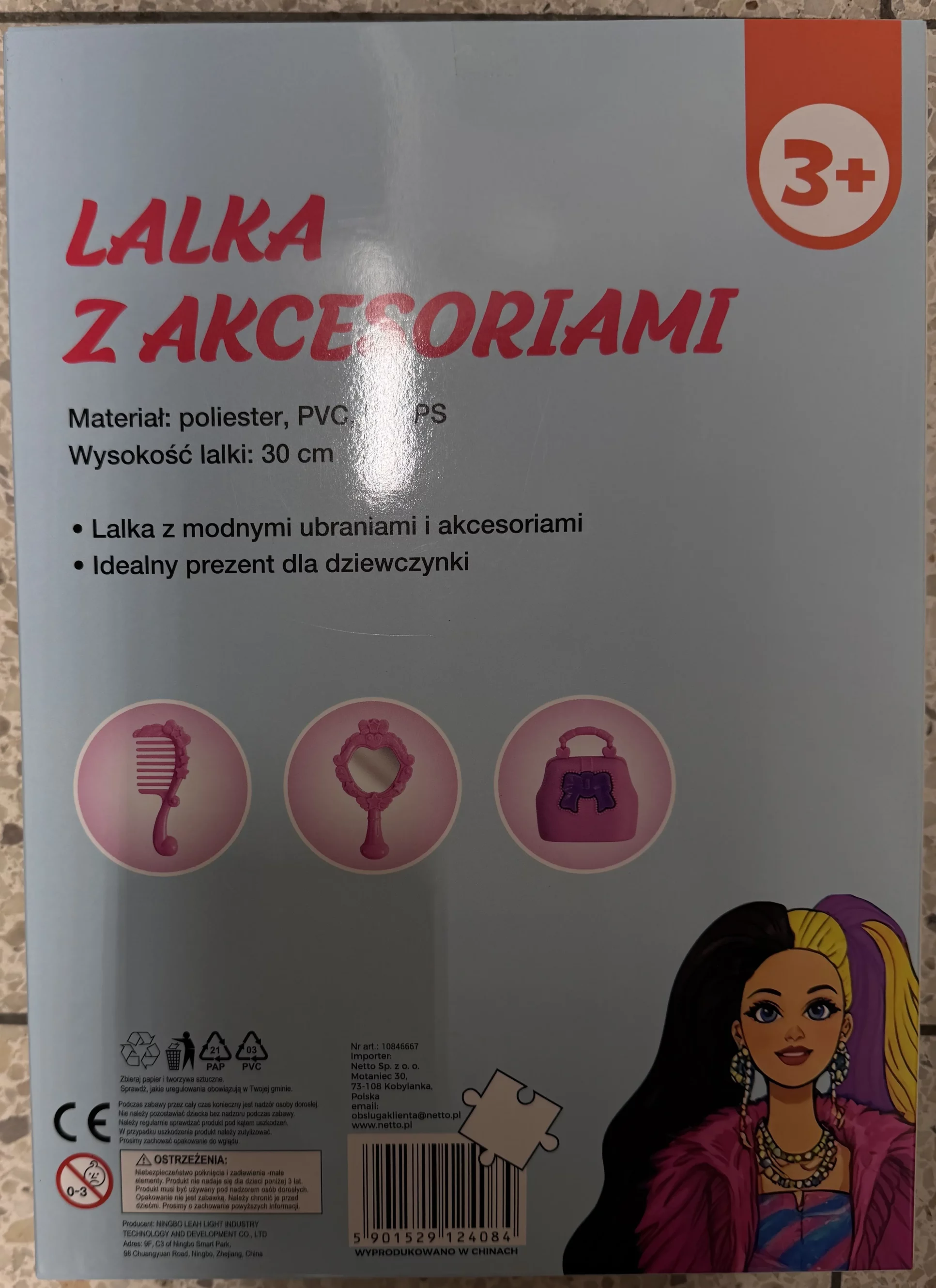 Plastic doll with plastic accessories.