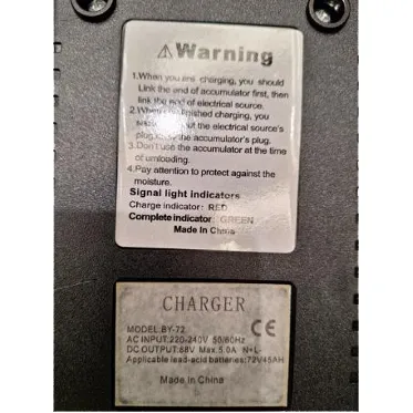 Electric motorcycle supplied with a wall plug and a charger.