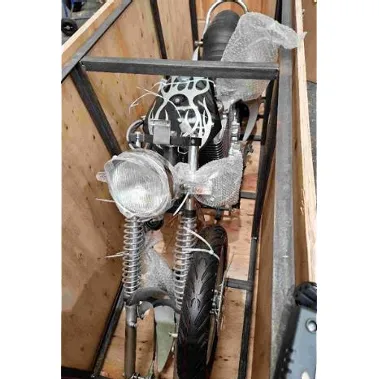 Electric motorcycle supplied with a wall plug and a charger.
