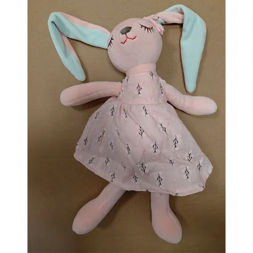 Soft toy, in the shape of a pink rabbit with long green and pink ears, wearing a pink dress.