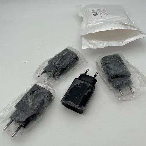 Black mains fast charger adaptor with USB ports.