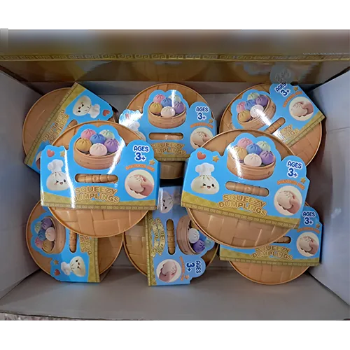 Squeeze toy in the shape of a Chinese dumpling in a plastic container made to resemble a bamboo steamer.