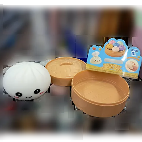 Squeeze toy in the shape of a Chinese dumpling in a plastic container made to resemble a bamboo steamer.