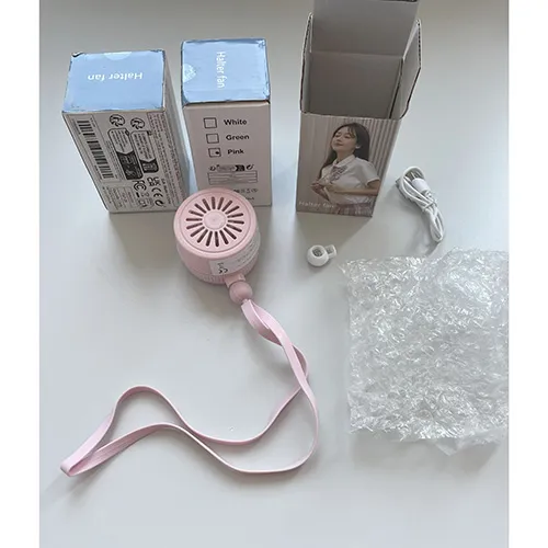 Rechargeable portable neck fan with a pink plastic housing and a silicone neck strap, sold together with a USB charging cable.