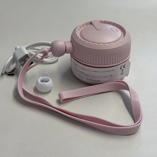 Rechargeable portable neck fan with a pink plastic housing and a silicone neck strap, sold together with a USB charging cable.