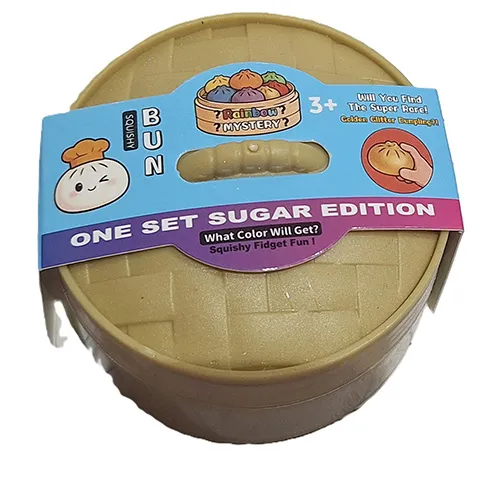 Squeeze toy in the shape of a Chinese dumpling in a plastic container made to resemble a bamboo steamer.