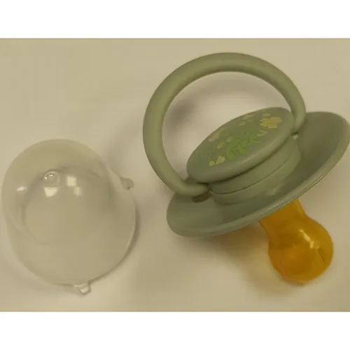Green latex soother.