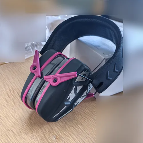 Black and pink earmuffs with packaging stating Slim Passive Earmuffs SNR 28 dB.