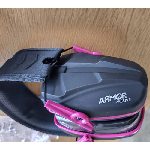 Black and pink earmuffs with packaging stating Slim Passive Earmuffs SNR 28 dB.