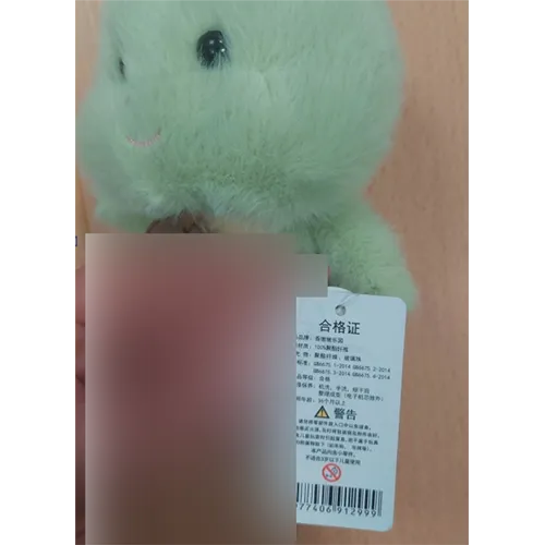 Set of two soft toys: one in the form of a green-coloured baby dinosaur and another in the form of a blue elephant.