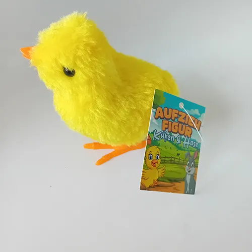 Wind-up toy in the shape of a chicken made of rigid plastic and covered with soft fabric. When the key is wound up, the toy moves.