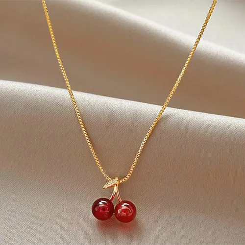 Necklace with a cherry-shaped charm.