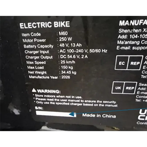 Electric bicycle with wall plug and charging supply.