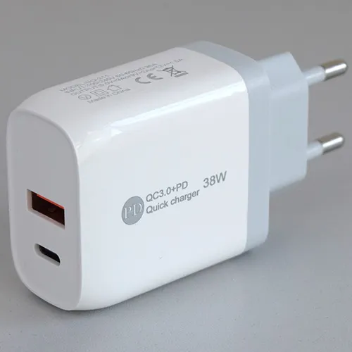 White USB charger with one USB-A and one USB-C port, supplied with a separate USB connection cable. Input: 100-240V, 50-60Hz, 0.35A. Output: 5V/3A, 9V/2A, 12V/1.5A.