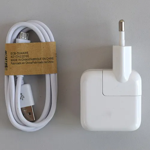 White battery charger with a USB-A port and Micro-USB cable. Input: 100-240V, 50-60Hz. Output: 5.1V, 2.1A.