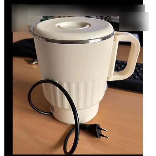 Foldable, black travel camping kettle, 100 ml  – 600 W 304. Made of stainless steel, advertised as BPA-free – double-walled design with automatic temperature control and continuous boiling function.