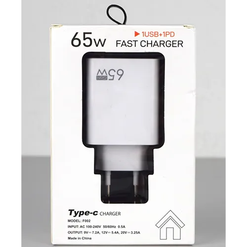 White USB charger with one USB-A and one USB-C port, integrated with a mains plug. Input: 100-240 V, 50/60 Hz, 0.5 A. Output: 9 V/7.2 A, 12 V/5.4 A, 20 V/3.25 A.