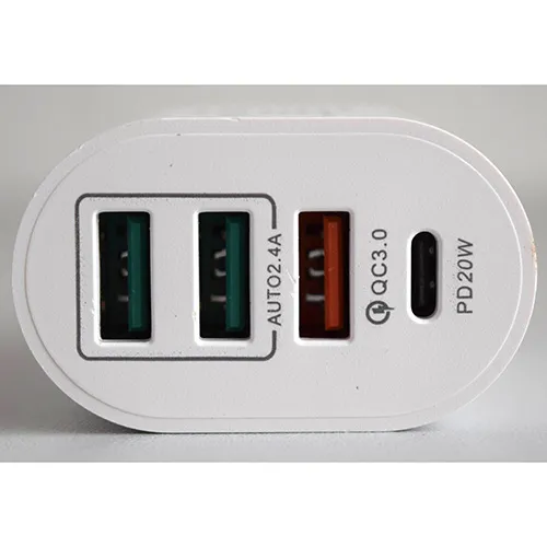 White plastic USB charger integrated with a European plug, featuring three USB Type-A ports and one USB Type-C port on the front interface.