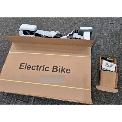 Electric bicycle with wall plug and power adapter.