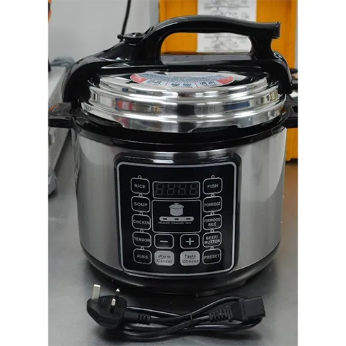 Electric pressure cooker with attached wall plug.