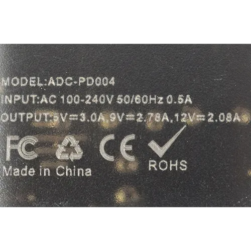 Black plastic mains wall charger with one USB Type-A output port.
