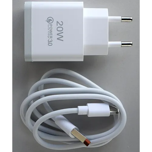 White plastic mains wall charger with one USB Type-A output port, sold with a separate white cable.