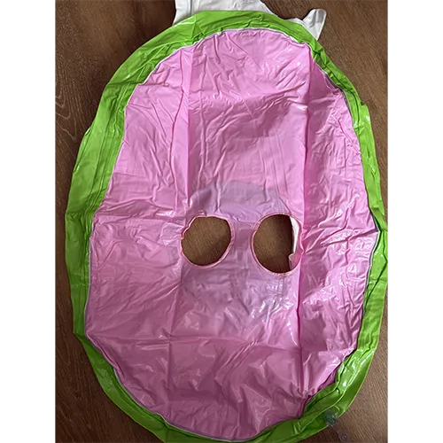 Green and white inflatable swim seat in the shape of a cow