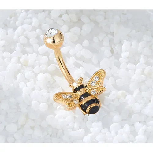 Navel/belly gold-coloured metal piercing with bee-shaped decoration.