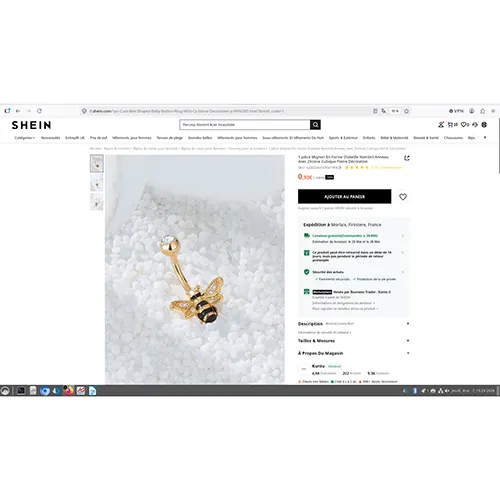 Navel/belly gold-coloured metal piercing with bee-shaped decoration.