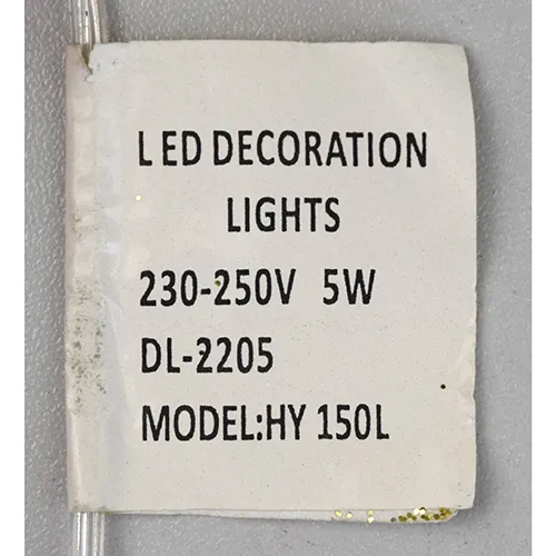 Decorative luminaire in the shape of a reindeer with yellow LED lights, gold-coloured glitter body, transparent insulated wires, and a white electronic controller box marked EK-04. Product is supplied with a cord extension set.